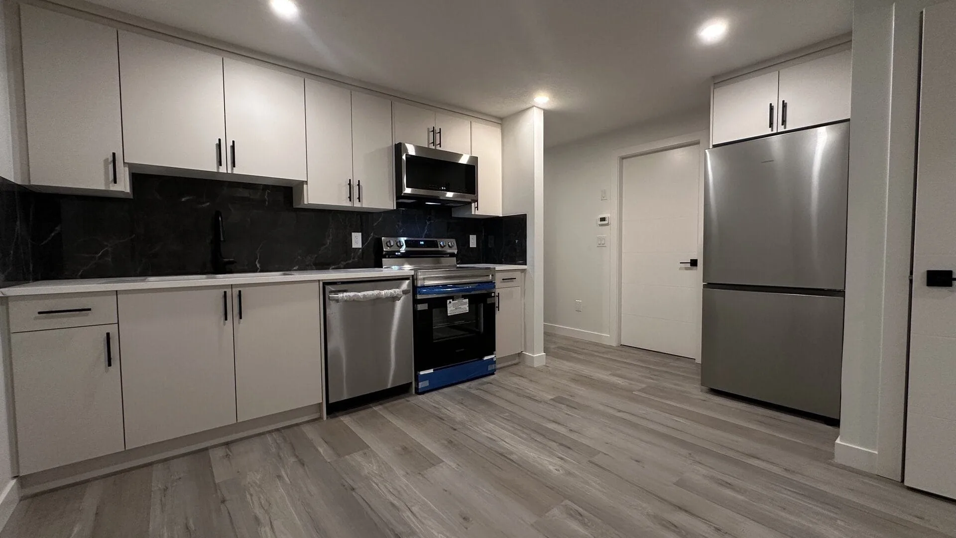 Completed Calgary legal suite by OAF Construction for secondary suite rental use.