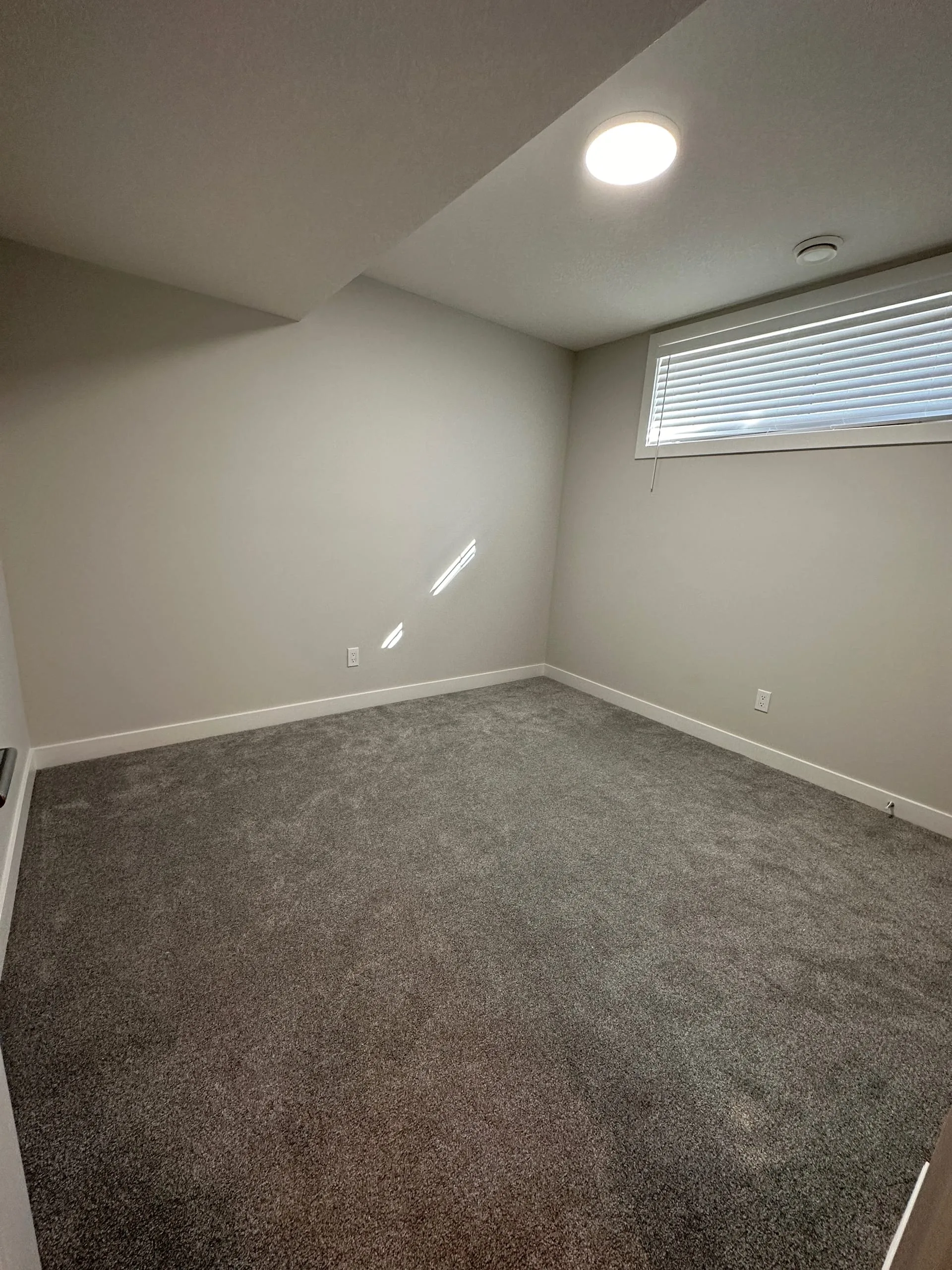 Finished basement living space built by OAF Construction for the Calgary region.