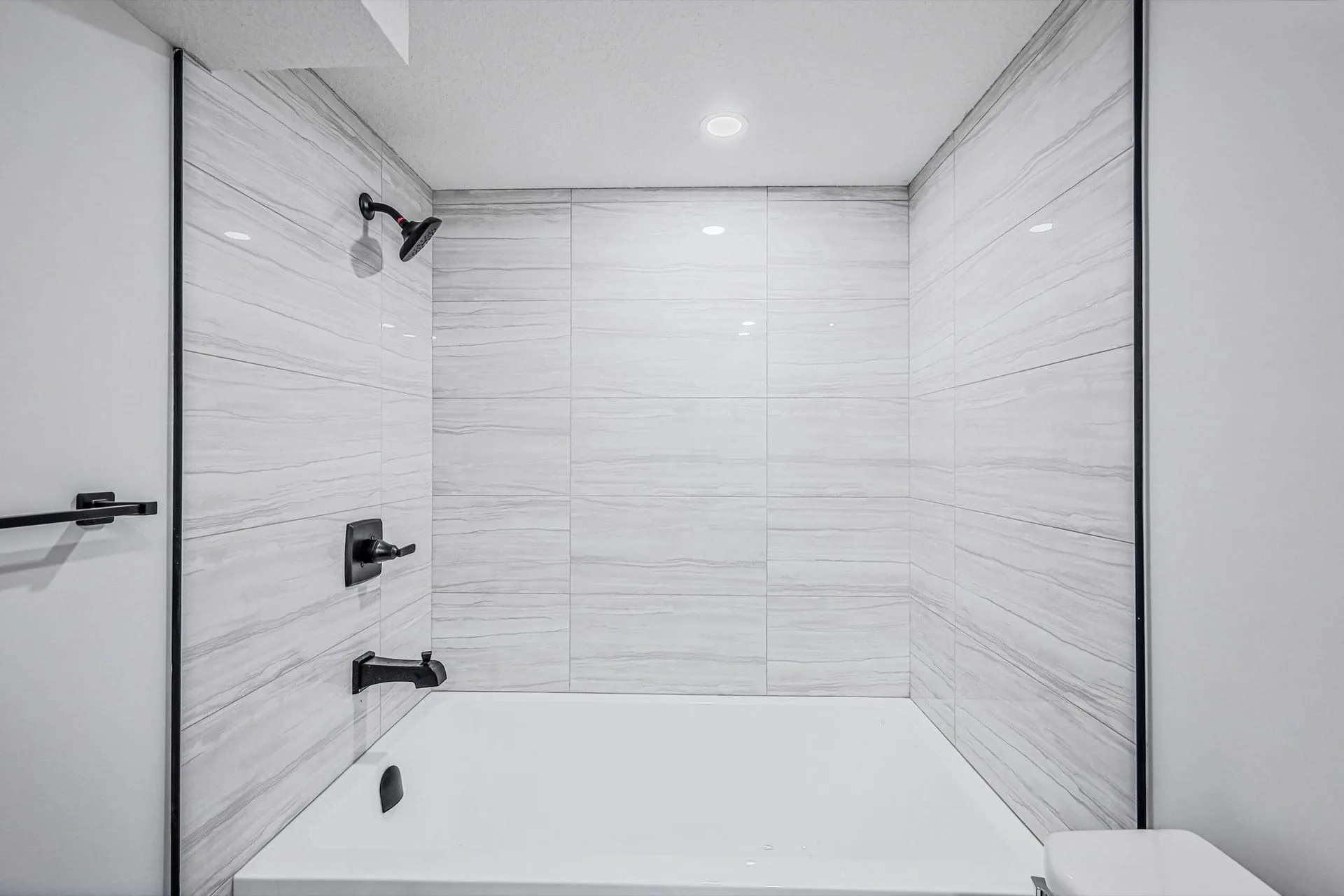 Calgary legal suite overview showing finished basement suite layout by OAF Construction.